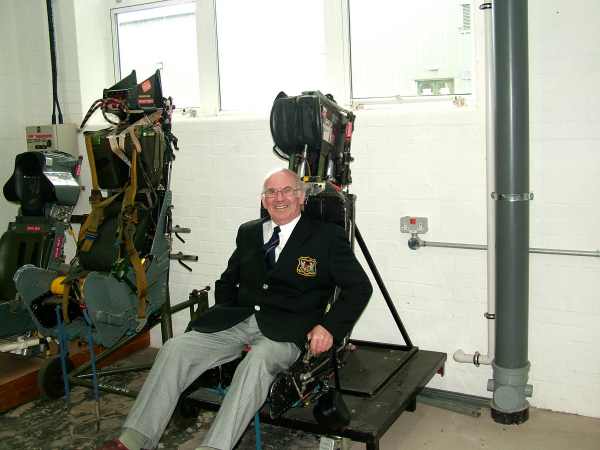 Andy about to be ejected. man sitting in an aircraft ejector seat.