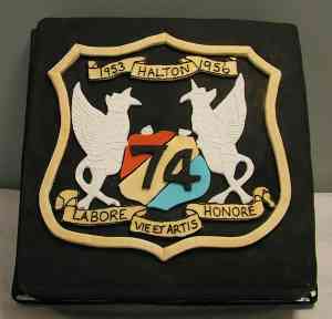 74th Entry Golden Celebration cake. A large cake with a latin motto and emblem