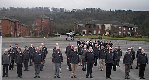 A group of seventy year olds marching on a parade ground